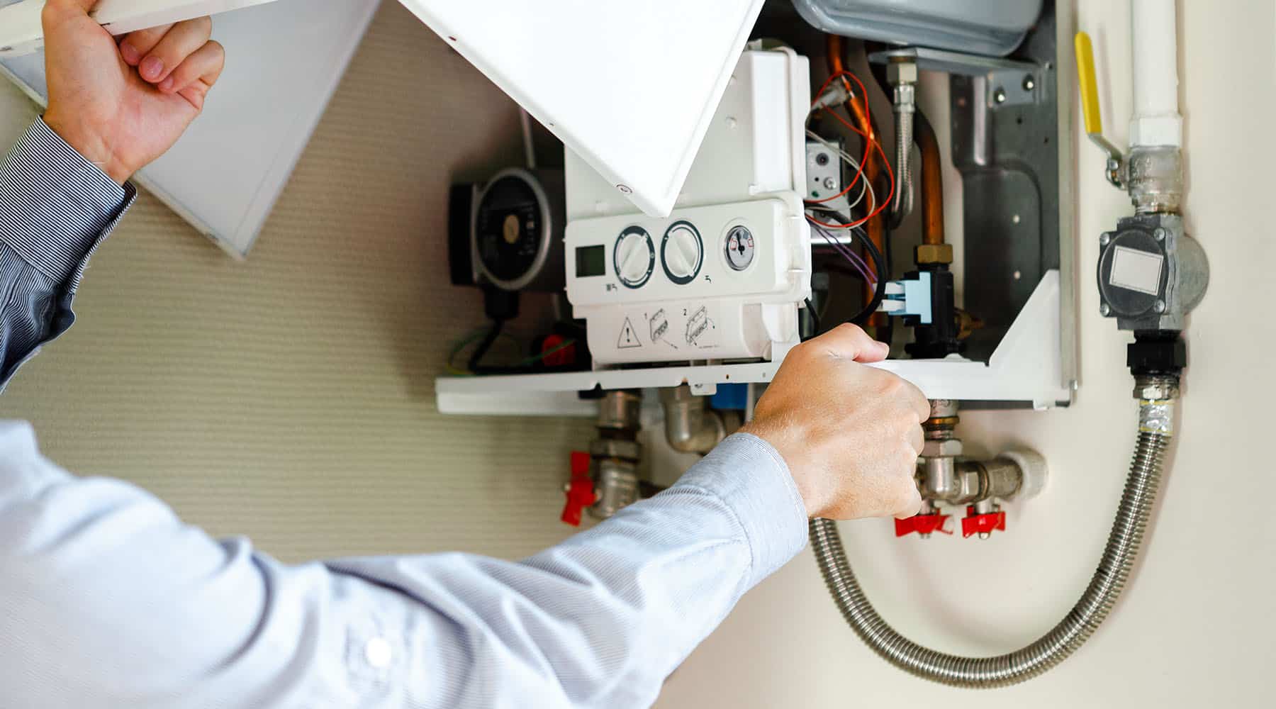 plumber installing tankless water heater
